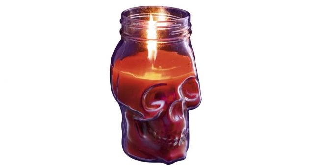 Sveča v obliki lobanje z svečnik
